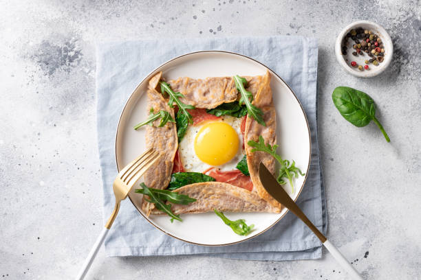 istock buckwheat crepe galette with egg, ham and spinach 1300793557