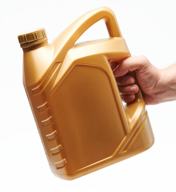 istock Yellow plastic jerry can in hand 1300795925