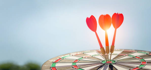 istock Red dart target with arrows ,Image for target business, marketing solution concept.of dartboard with sky background. 1300797354
