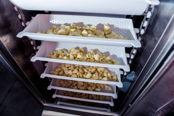 istock Conveyor line for packing snacks and chips in a modern factory 1300799367