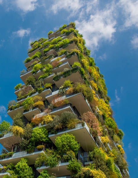 Milan vertical forest milan italy 10 April 2019: houses with garden on the terrace green skyscraper stock pictures, royalty-free photos & images