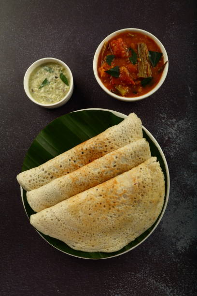 Tamilnadu foods- dosa with sambar. South Indian street foods- fresh cooked dosai with sambar and chutney. thosai stock pictures, royalty-free photos & images