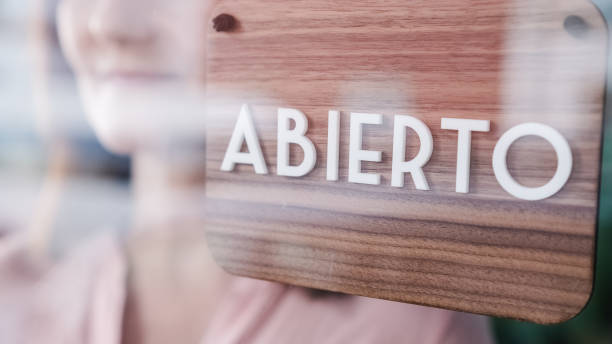 istock Closed sign hanging on a store door. 1300802792