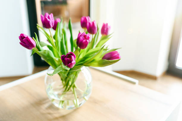 istock Beautiful pink tulips in a vase. 1300802865