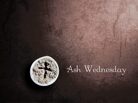 Ash Wednesday text with vintage background. Stock photo.
