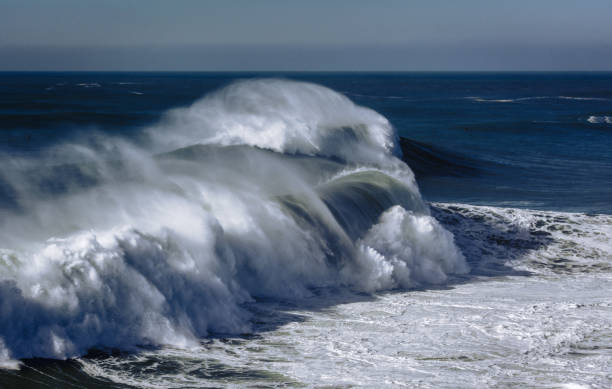 istock big wave breaking at Praia do Norte, Nazare 1300804988