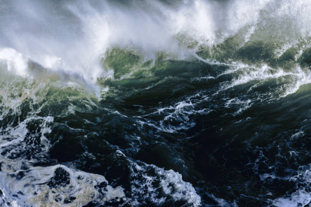 istock big wave breaking at Praia do Norte, Nazare 1300805012