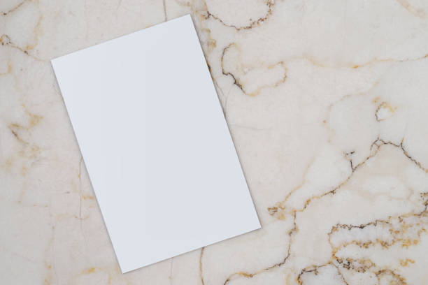 istock empty and blank business card,visiting card,calling card on marble table,close up, free copy space 1300805250