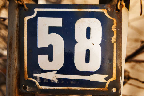 istock Weathered enameled plate number 58 1300806008