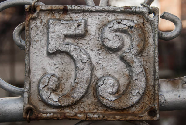 istock Old retro cast iron plate number 53 1300806022