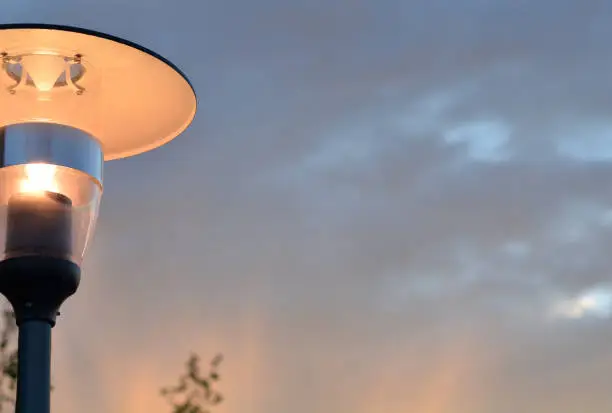 modern street lamp on background the sky in sunset