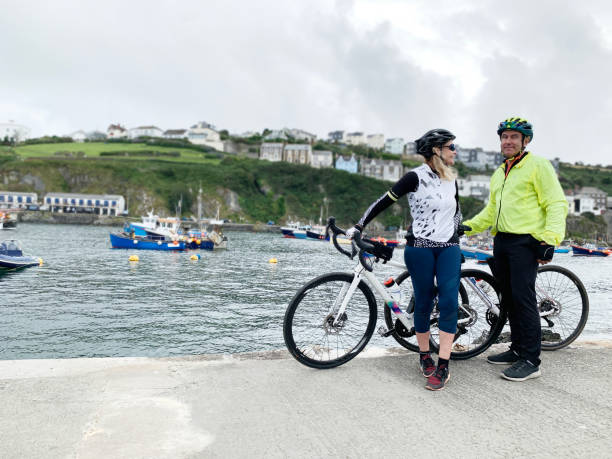 istock Mature couple with bikes, Mevagissey, Cornwall 1300808440