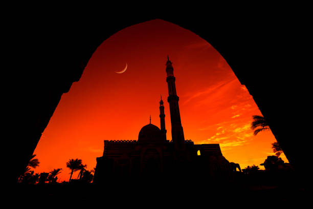 istock Beautiful large Islamic mosque at the sunset sky background 1300808810