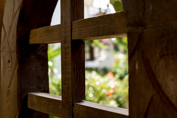 istock Old wooden doors at the beautiful tropical garden 1300809810