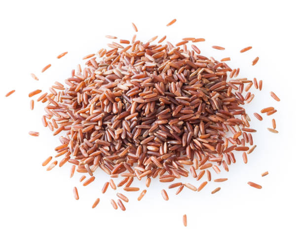 istock Heap of ncooked red rice isolated on white background 1300812801