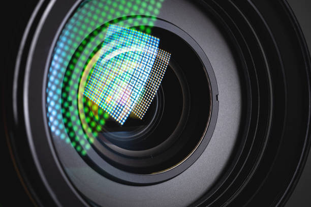 istock Close-up of a camera mirror lens front lens with aperture and highlights from a light source 1300814011