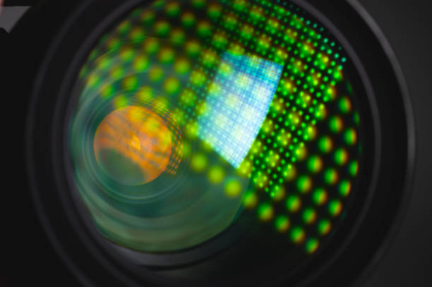 istock Close-up of a camera mirror lens front lens with aperture and highlights from a light source 1300814021
