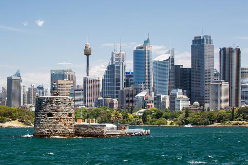 Sydney, Australia - November 30 2014: The view towards Sydney CBD over Fort Denison and Sydney Harbour on a hot spring day.