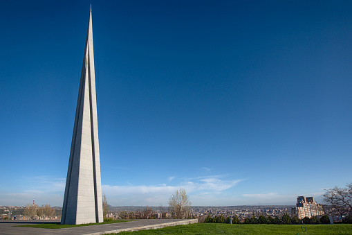 Yerevan, Armenia - April 13, 2020: Armenian Genocide memorial complex (Tsitsernakaberd) on a hill high above the city of Yerevan, the capital of Armenia.    \n\nThe complex on top of the hill of Tsitsernakaberd is Armenia's official memorial dedicated to the victims of the Armenian Genocide. It was built in 1967.\n\nPLEASE NOTE: The Armenian National Genocide Memorial is with open access to everybody, there is no entry restriction entry fees etc.