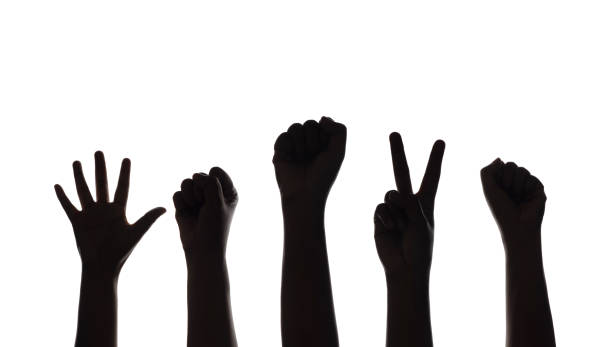 istock Silhouette of Hands for Protest or Strike isolated on White background 1300815107