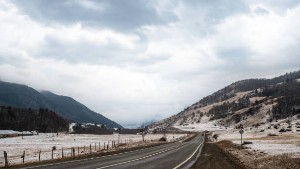 istock Cloudy morning over the road in the mountains 1300817579
