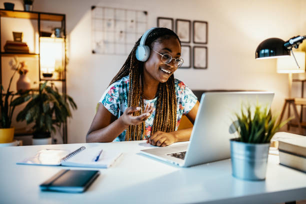 African American student attending webinar from home African American female student studying from home during lockdown virtual college education stock pictures, royalty-free photos & images