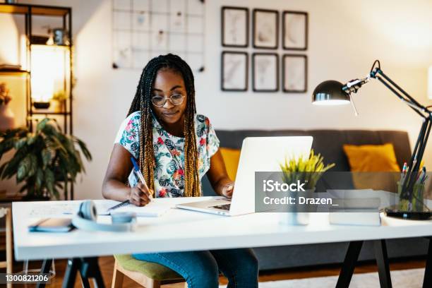 African American Graduate Student Studying From Home During Covid19 Pandemic Stock Photo - Download Image Now