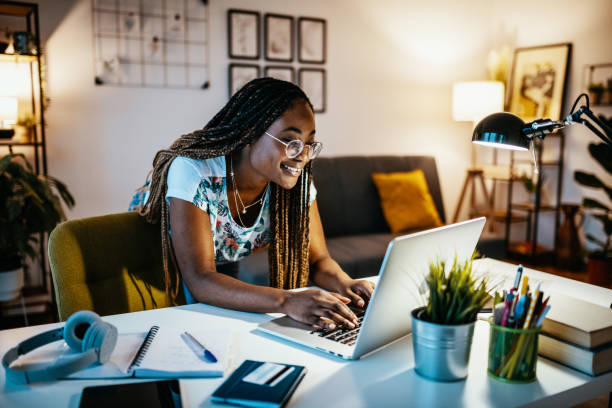 istock Modern African American female student having online meeting with students 1300821261