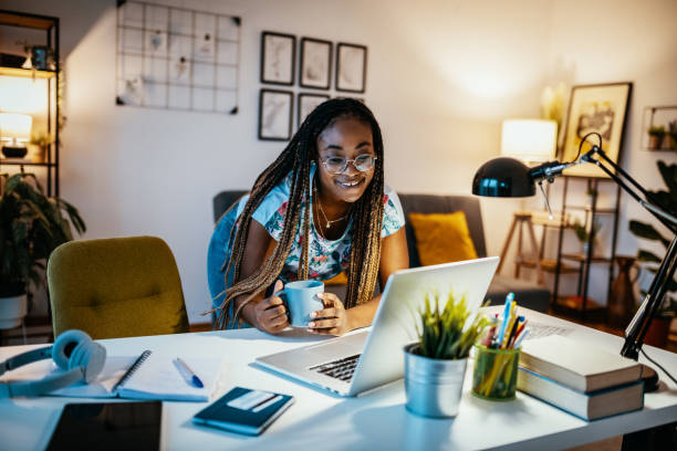 istock African American female student studying from home and drinking tea 1300821338