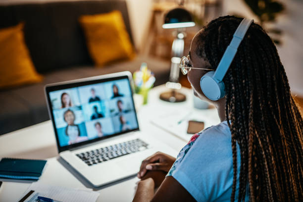 Group of unrecognisable international students having online meeting African American female student studying from home during lockdown braided hair photos stock pictures, royalty-free photos & images