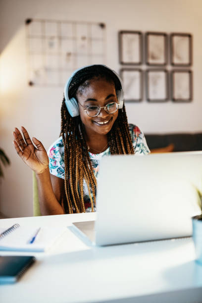 Hey, do you see me on video call? African American female student studying from home during lockdown e learning stock pictures, royalty-free photos & images