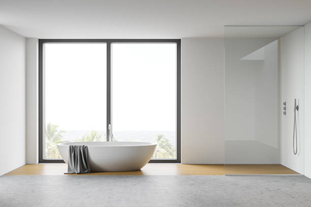 istock White bathroom interior with tub and shower 1300822658