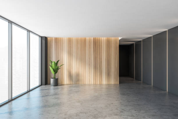 istock Black and wooden empty reception hall, grey floor near windows 1300822711