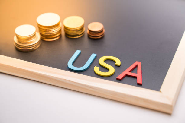 istock USA text on blackboard and coin 1300823689