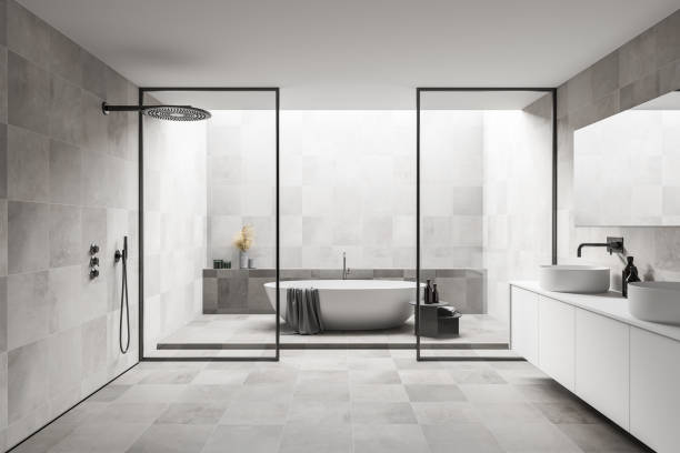 istock White bathroom interior with sink and tub 1300824328