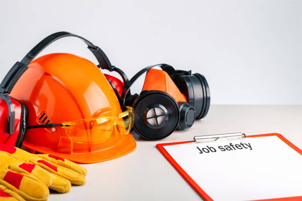 istock Job safety  write on a clipboard and personal protective equipment on the table. 1300825303
