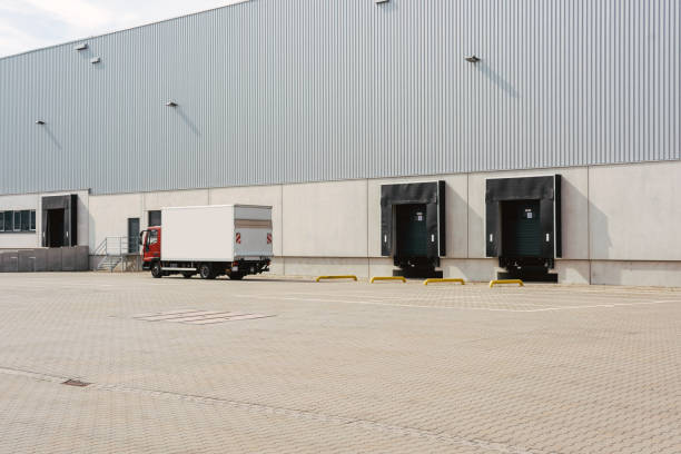 istock Truck at loading ramps of a warehouse 1300825982