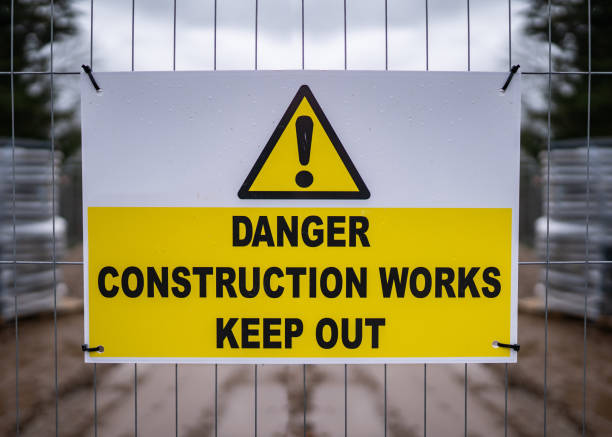 istock Danger construction site keep out modern clean yellow sign with triangle exclamation mark 1300827956
