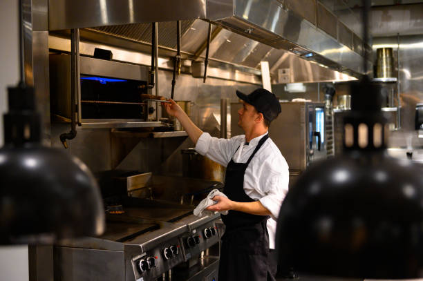 istock Chef cooking in a commercial kitchen 1300827983