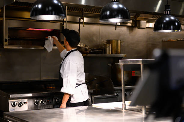 istock Chef cooking in a commercial kitchen 1300827986