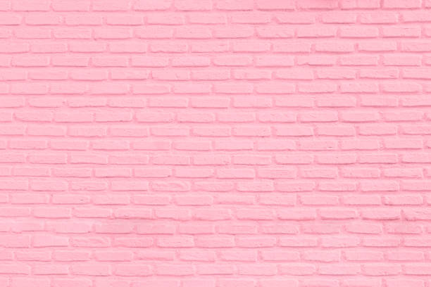 Pastel pink brick wall texture background stock photo