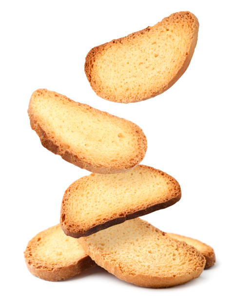 istock Bread rusks falling on a heap on a white background, levitating crackers. Isolated 1300829135