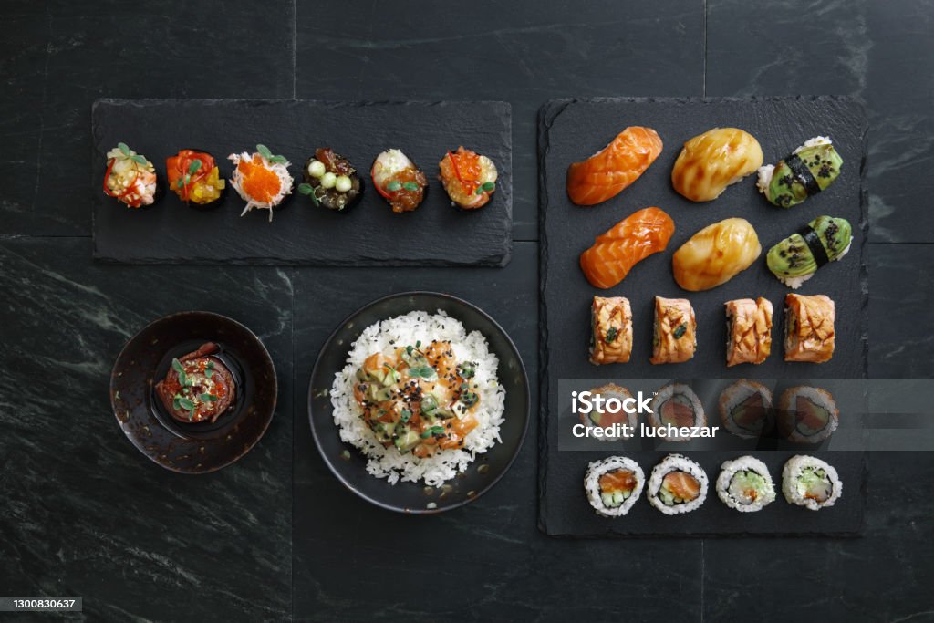 https://media.istockphoto.com/id/1300830637/photo/sushi-and-sushi-roll-set-rice-bowls-gunkan-set-tuna-tataki.jpg?s=1024x1024&w=is&k=20&c=tWQpl49yrstNScTmwwojrdeTntqYfj8EBy34EP0x_Y8=