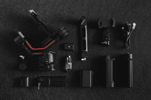 istock top view of work space photographer with digital camera, Gimbal Stabilizers and camera accessory 1300831029