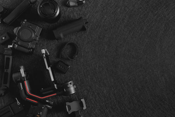 istock top view of work space photographer with digital camera, Gimbal Stabilizers and camera accessory 1300831031