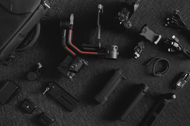 istock top view of work space photographer with digital camera, Gimbal Stabilizers and camera accessory 1300831034