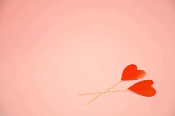 istock two hearts lie on a pink background. valentine's day concept 1300831731