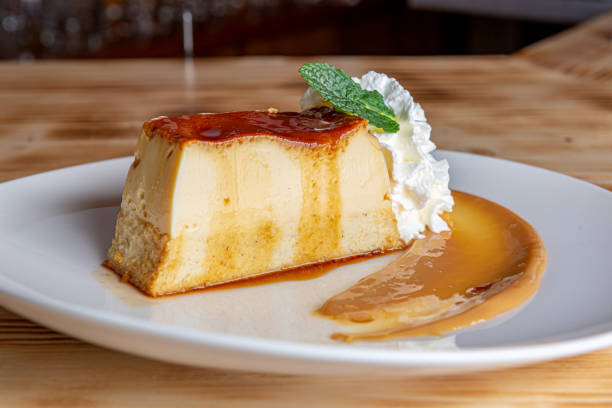 istock Homemade flan with cream and mint leaf 1300833244
