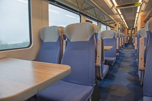 istock Interior of an empty commuter train carriage with seats 1300834124