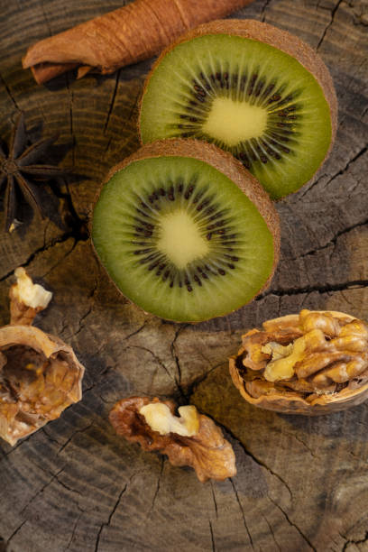 istock Kiwi on a wooden background 1300834164